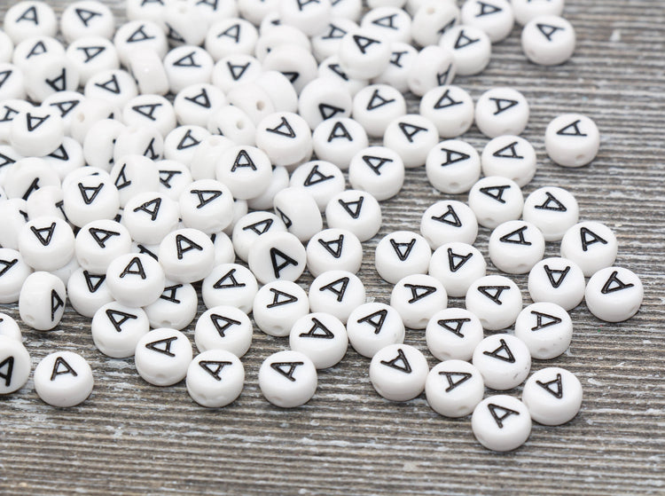 white beads with black letter A printed on each