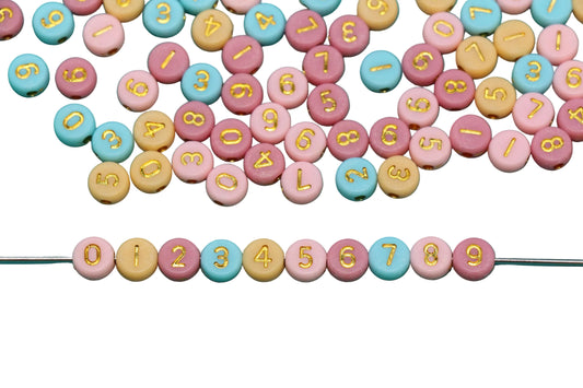 Colorful beads with numbers and letters on a white background