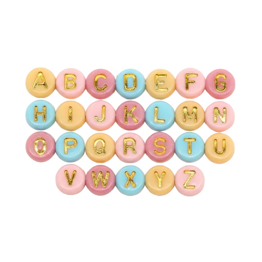 Pastel-colored alphabet letters with gold accents on a white background