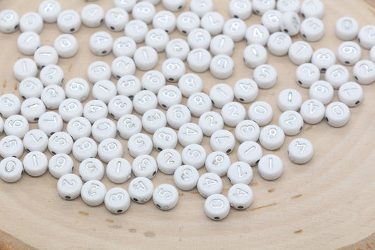 white 7 mm round acrylic number beads with silver numbers; white beads with silver numbers
