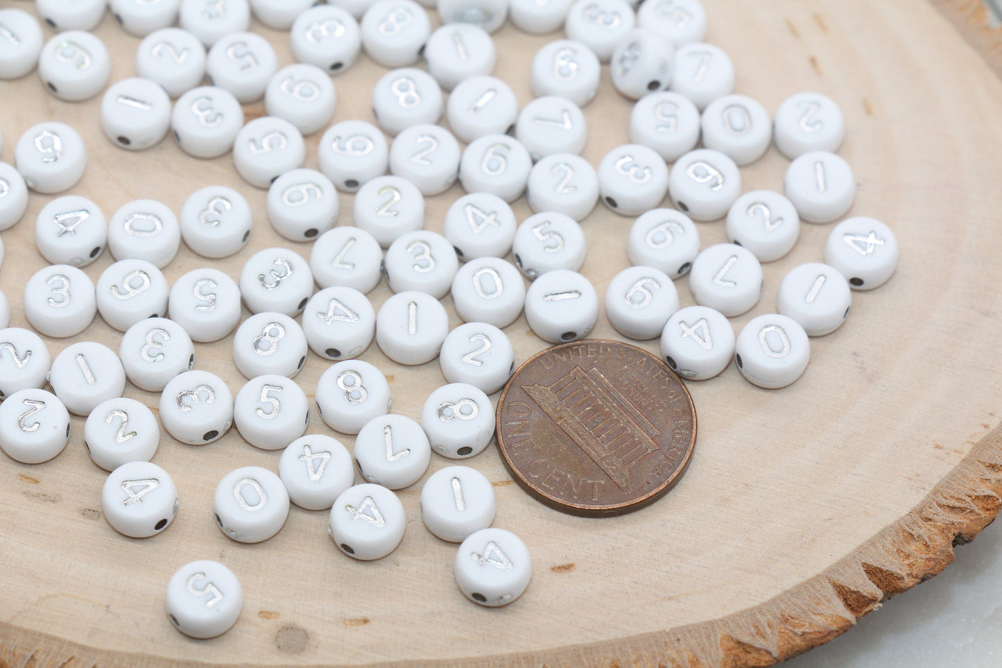 white 7 mm round acrylic number beads with silver numbers; white beads with silver numbers