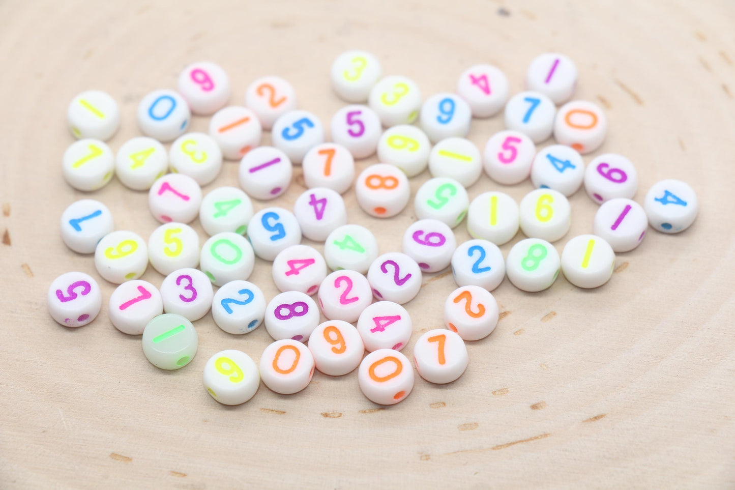 7 mm round acrylic neon number beads on white base; white with neon numbers