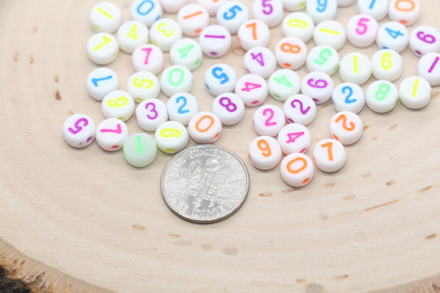 7 mm round acrylic neon number beads on white base; white with neon numbers