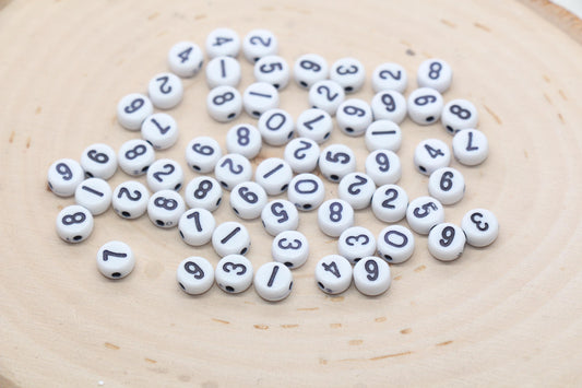 white 7 mm round acrylic number beads with black numbers; white beads with black numbers