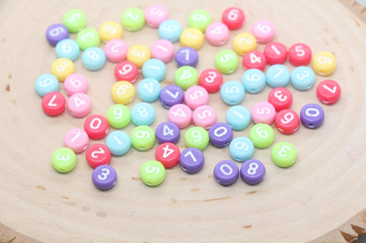 7 mm round acrylic multicolor number beads on white base; white with color numbers