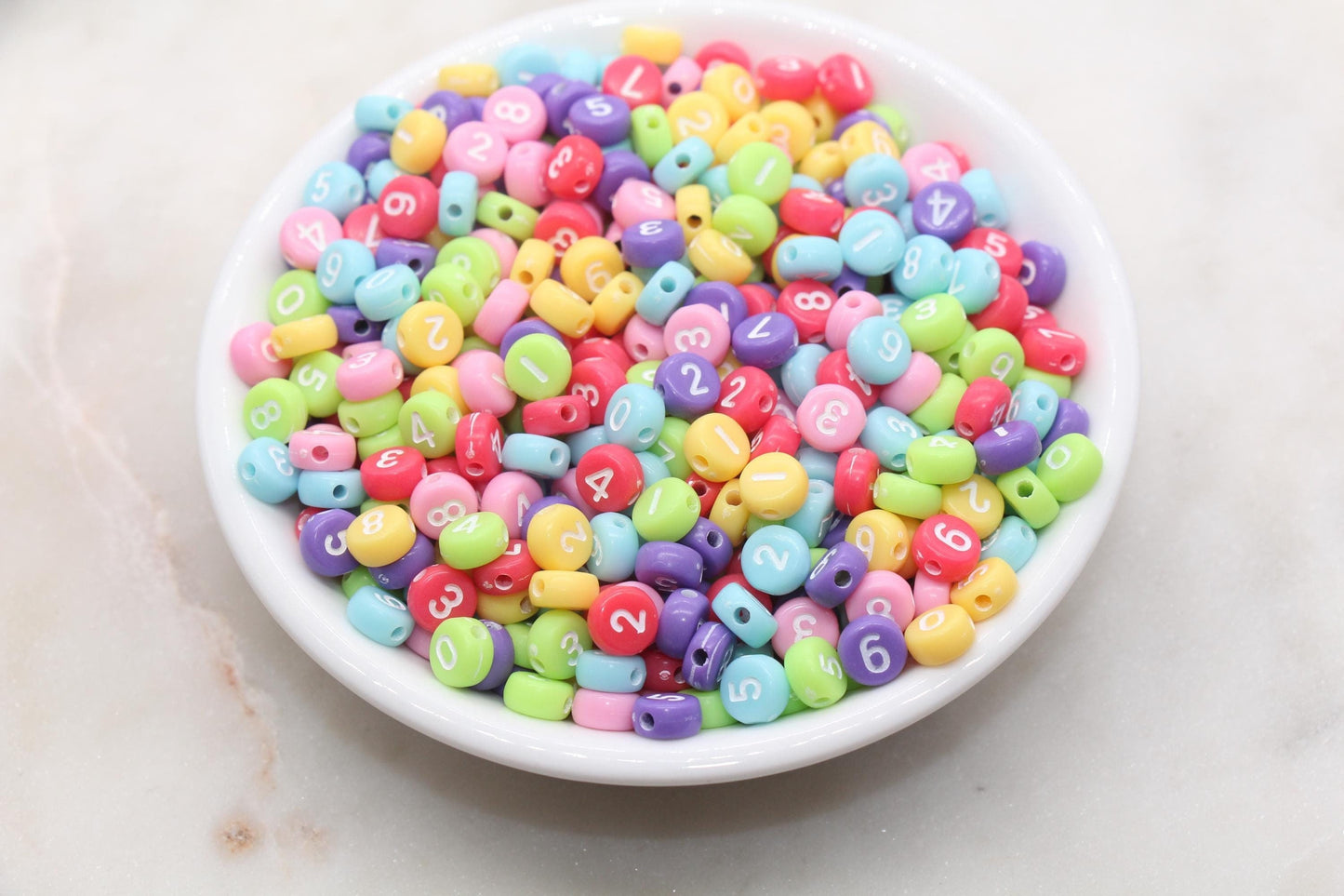 7 mm round acrylic multicolor number beads on white base; white with color numbers
