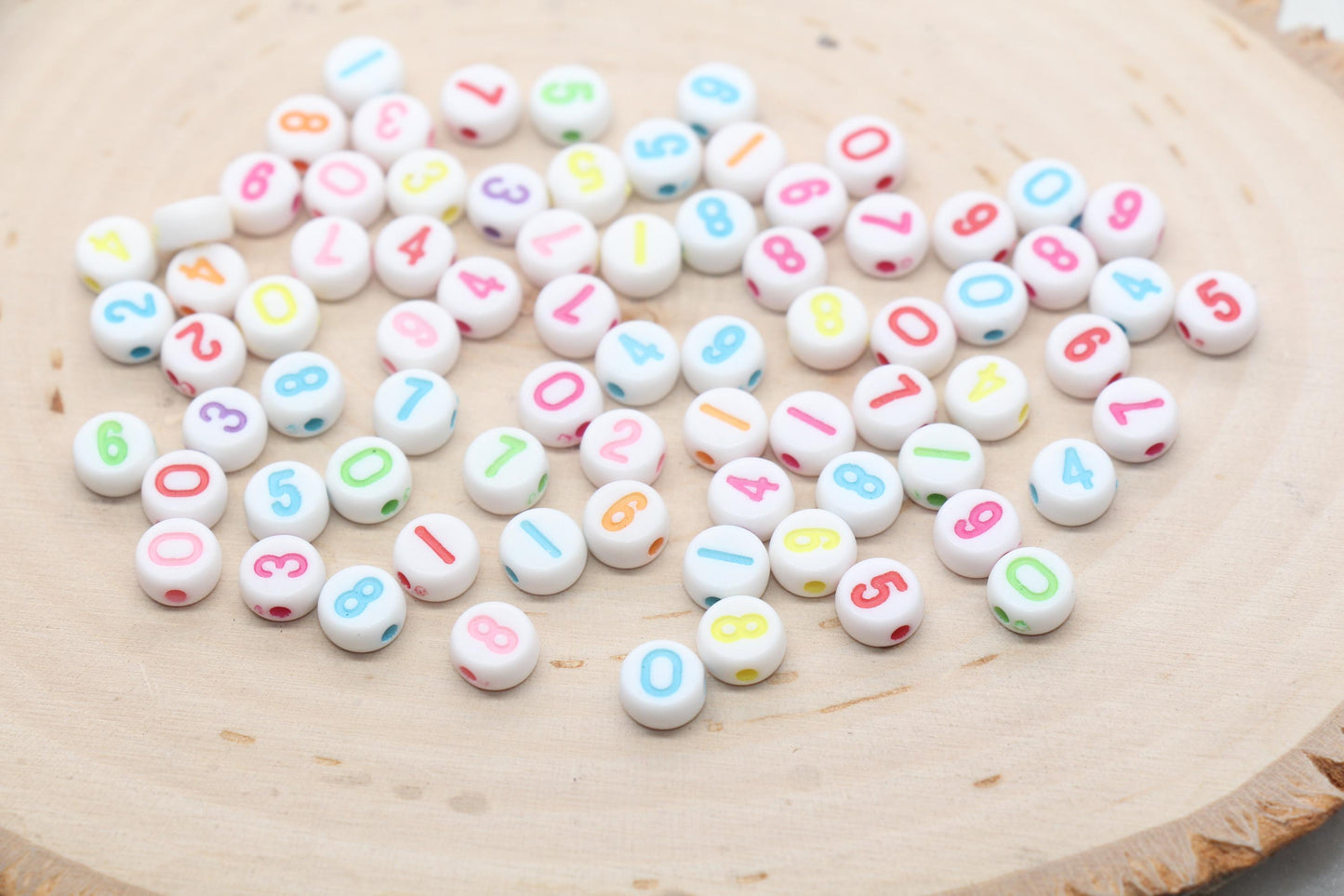 white 7 mm round acrylic number beads with multicolor numbers; white beads with multicolor numbers