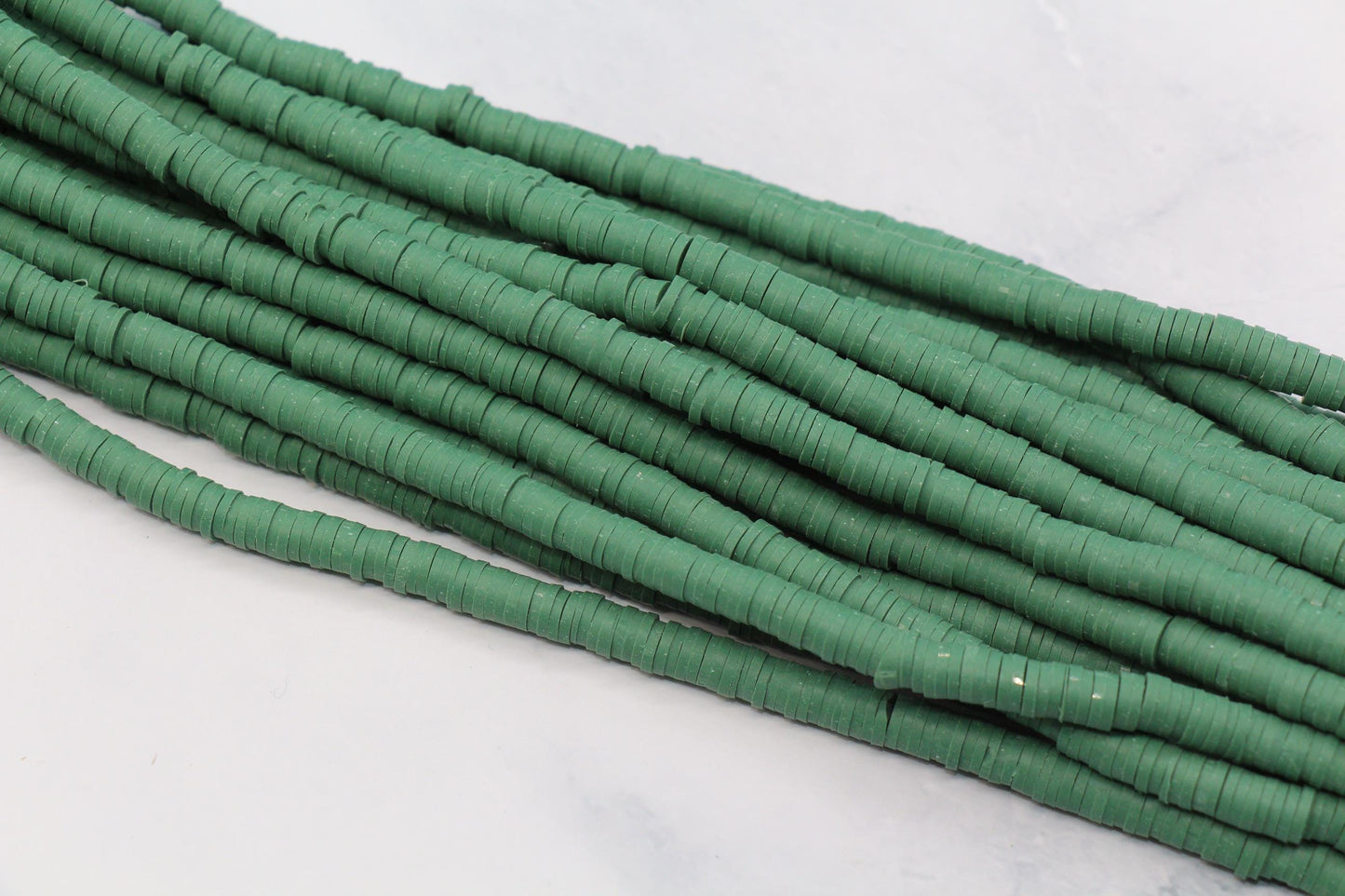 6mm sage green heishi beads strand close up for bracelet making
