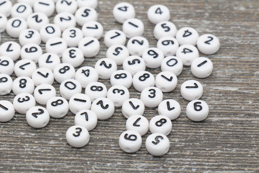 individual 7 mm flat round acrylic number beads, white with black numbers; white number beads