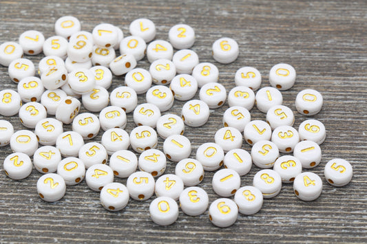 7 mm round acrylic number beads, white with gold numbers; 7mm round