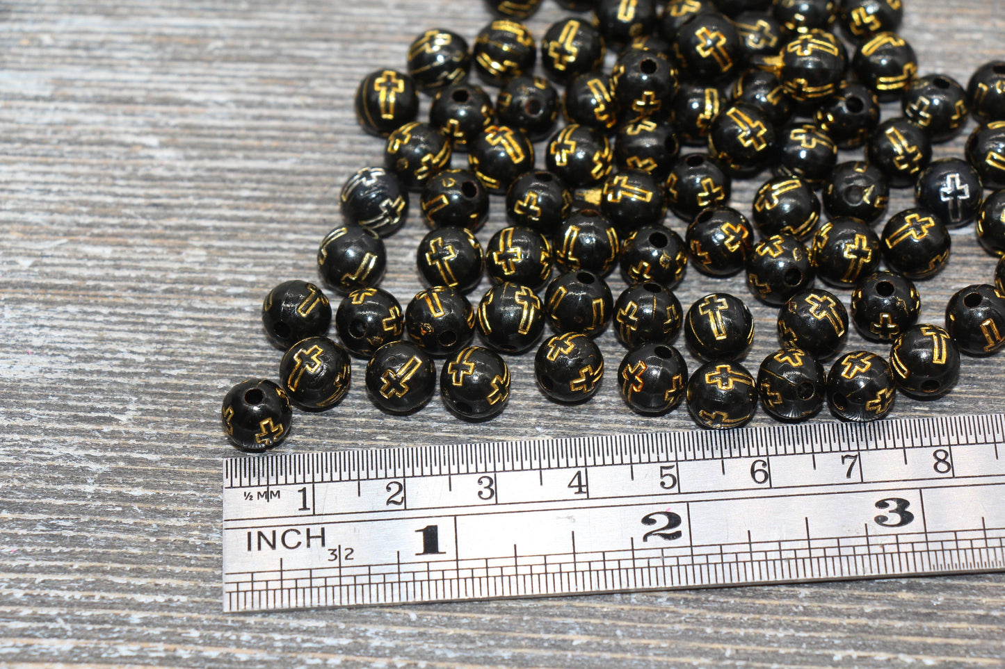 8mm black with gold cross beads, acrylic symbol beads, detail view