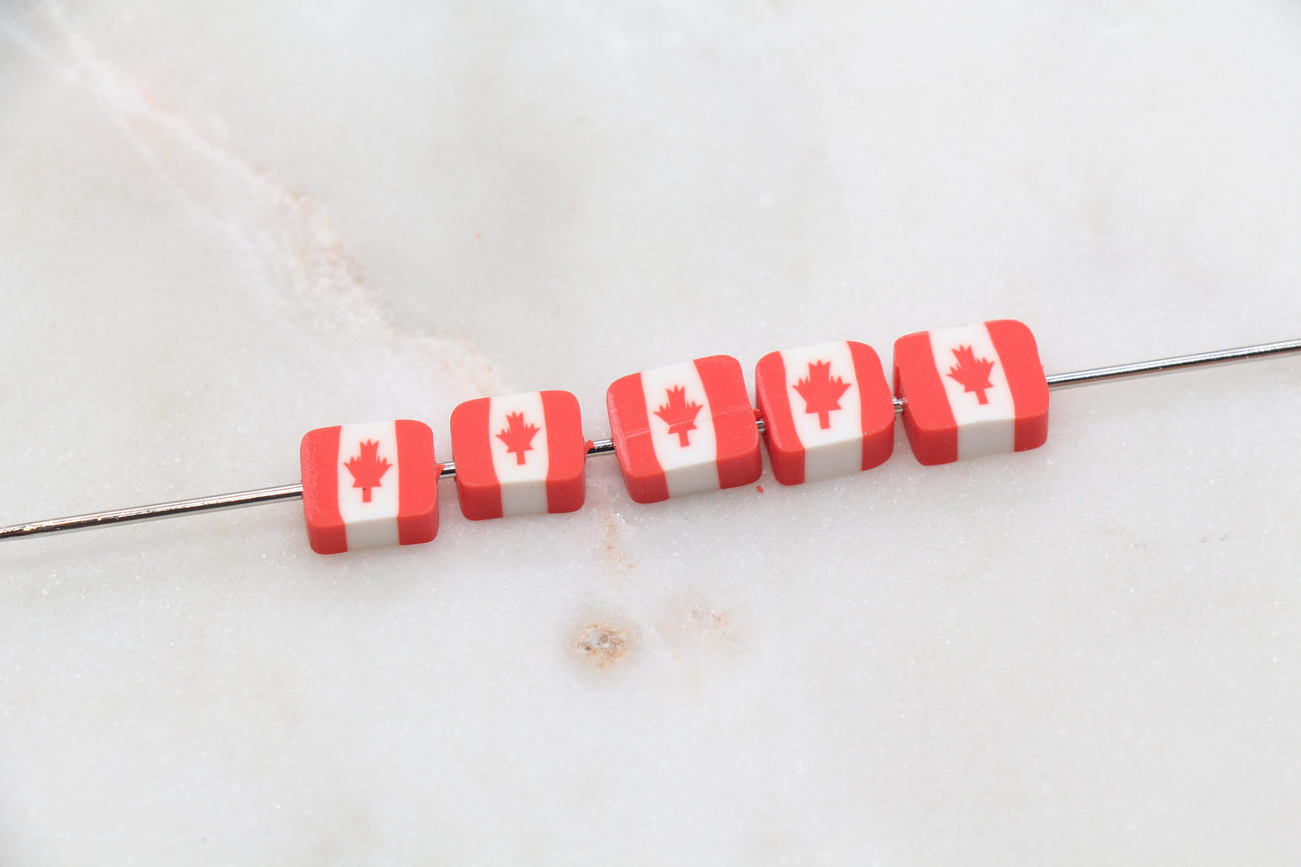 Canadian flag polymer clay beads in round and square shapes, red and white maple leaf craft beads