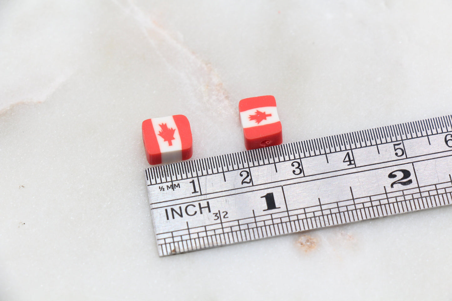 Canadian flag polymer clay beads in round and square shapes, red and white maple leaf craft beads