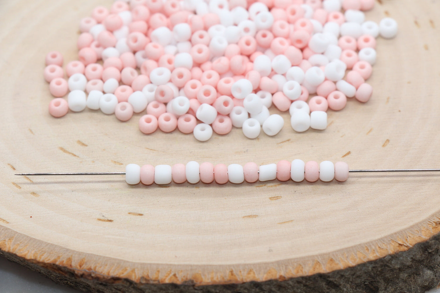 Assorted vibrant seed beads in various colors and sizes, ideal for crafting jewelry such as bracelets and necklaces and other craft