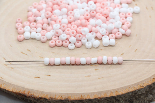Assorted vibrant  seed beads in various colors and sizes, ideal for crafting jewelry such as bracelets and necklaces and other craft