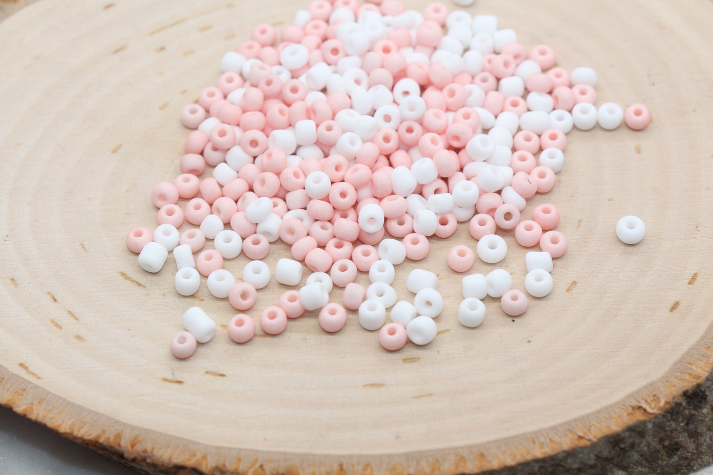 Assorted vibrant seed beads in various colors and sizes, ideal for crafting jewelry such as bracelets and necklaces and other craft