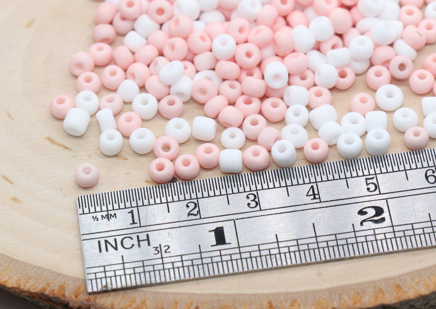 Assorted vibrant seed beads in various colors and sizes, ideal for crafting jewelry such as bracelets and necklaces and other craft