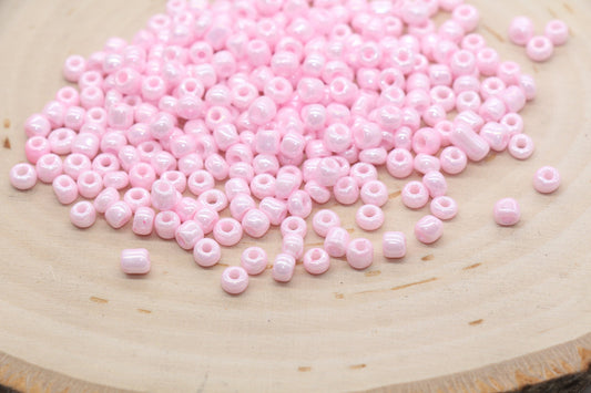 Glossy Pink Seed Beads, ideal for crafting jewelry such as bracelets and necklaces and other crafts.