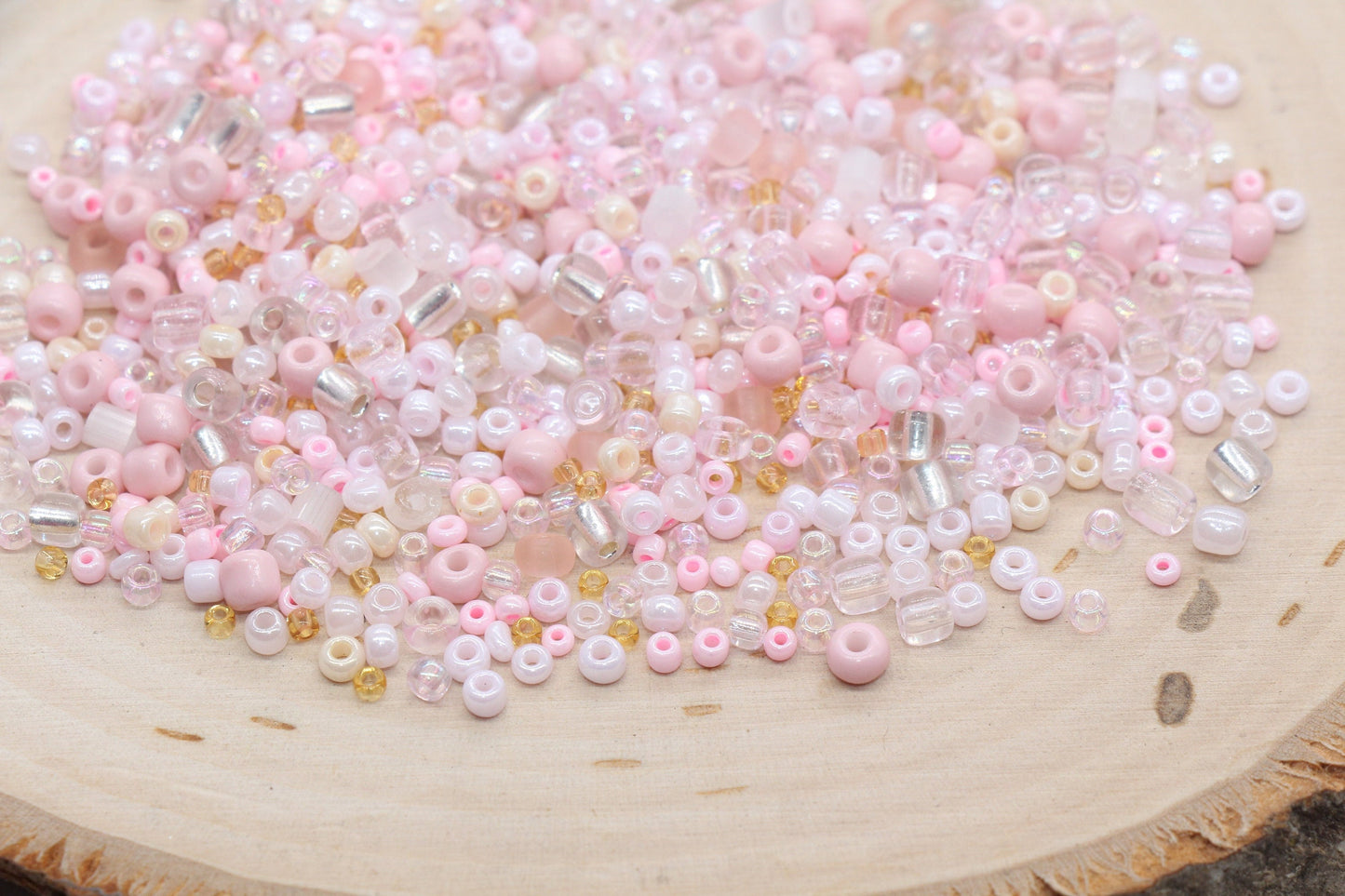 Assorted vibrant seed beads in various colors and sizes, ideal for crafting jewelry such as bracelets and necklaces and other craft