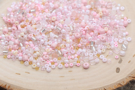 Assorted vibrant seed beads in various colors and sizes, ideal for crafting jewelry such as bracelets and necklaces and other craft