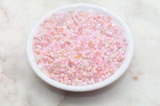 Assorted vibrant seed beads in various colors and sizes, ideal for crafting jewelry such as bracelets and necklaces and other craft