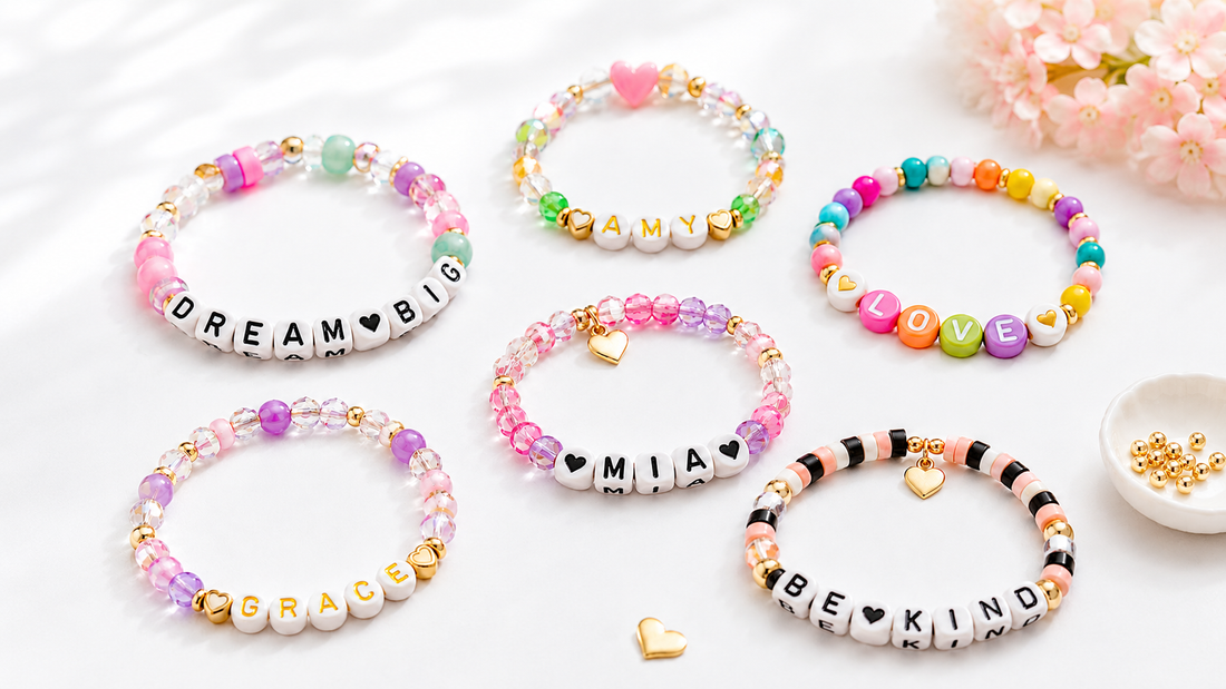 DIY name bracelets with letter beads, colorful accent beads, gold spacers, and heart charms