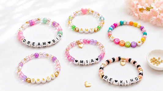 DIY name bracelets with letter beads, colorful accent beads, gold spacers, and heart charms