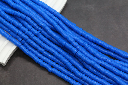 Blue cylindrical beads on a dark surface