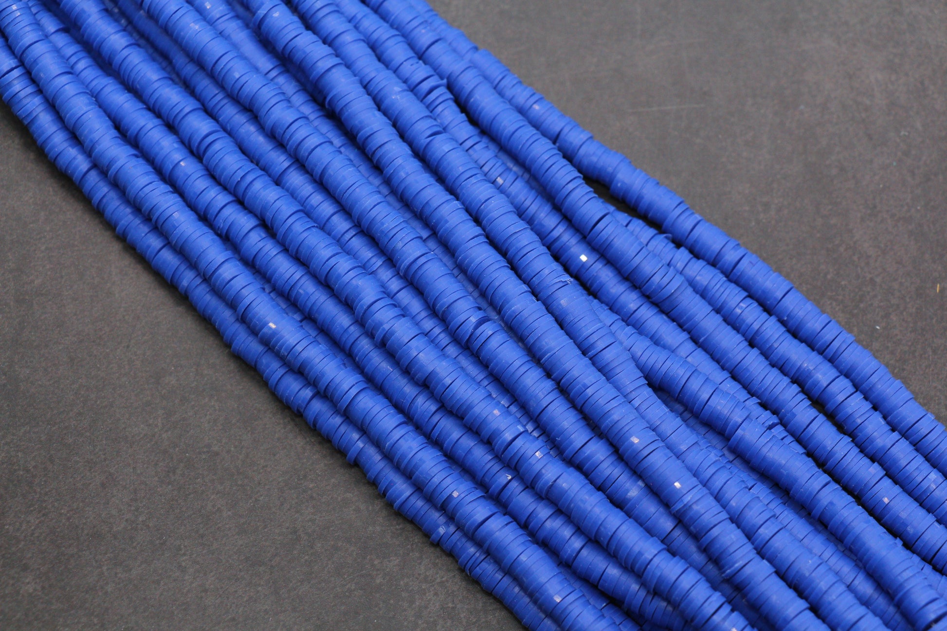Blue beads on a dark gray background