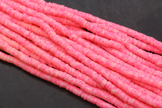 Close-up of pink beads on a black background