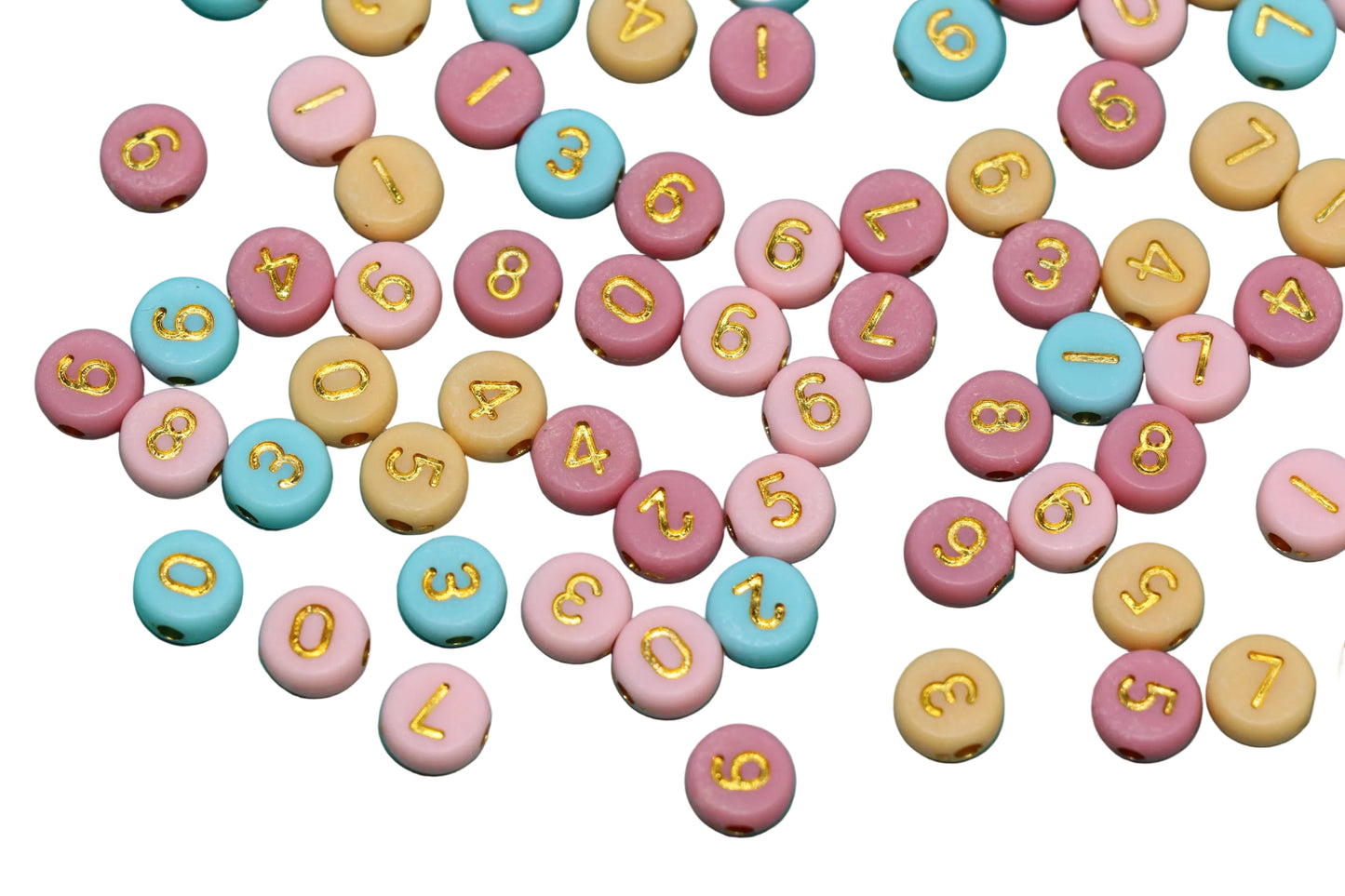 Colorful round candies with numbers and letters on a white background
