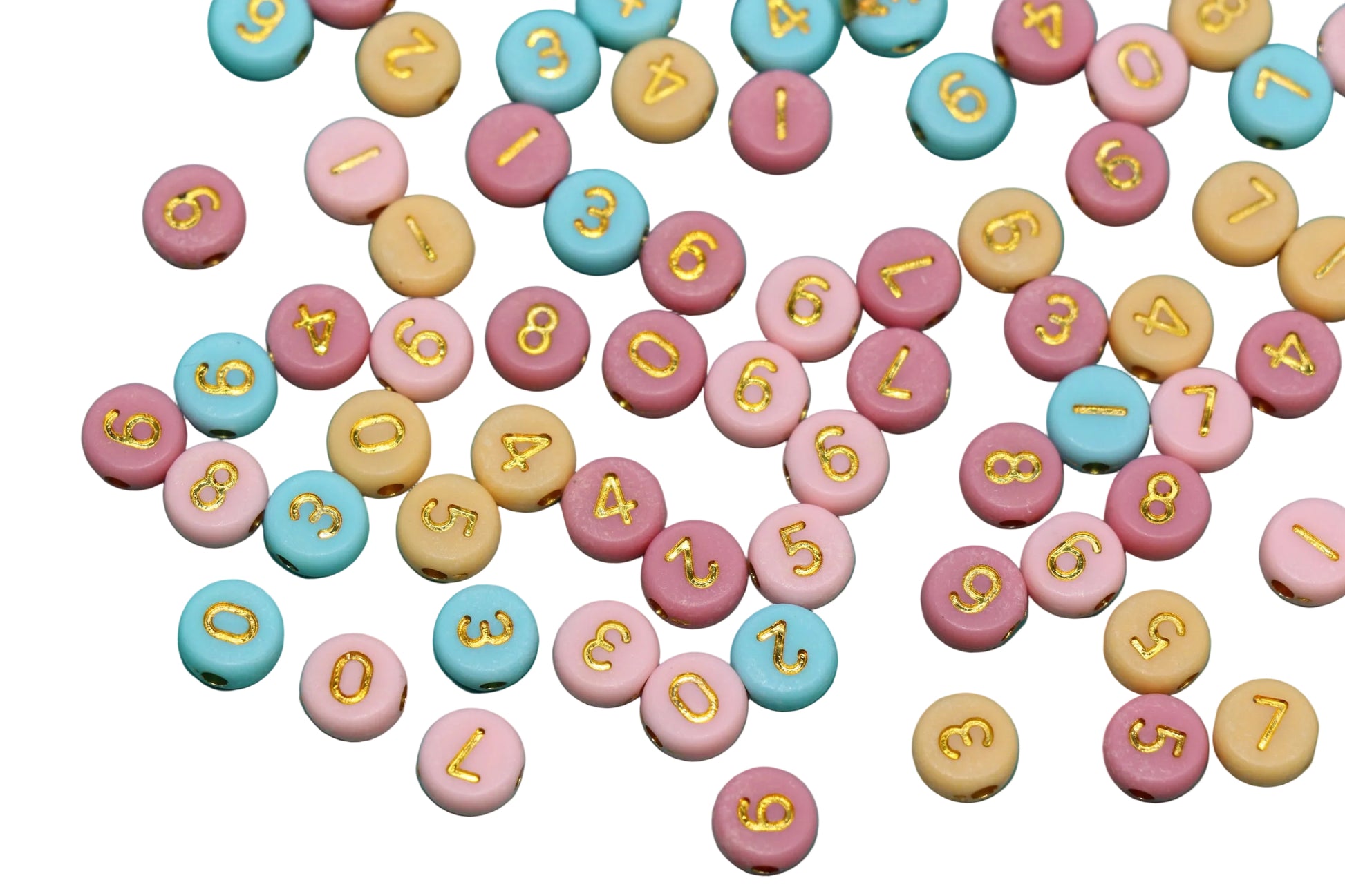 Colorful round candies with numbers and letters on a white background