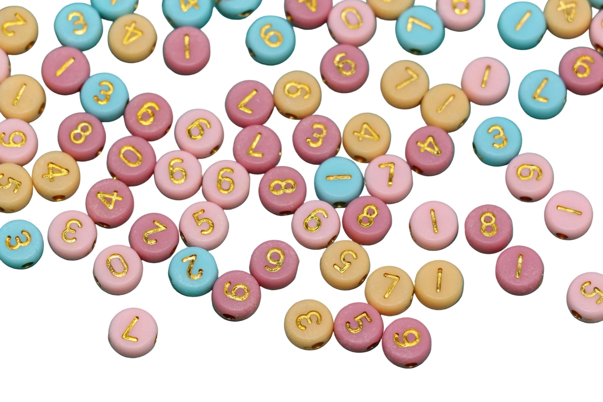 Colorful round candies with numbers and letters on a white background