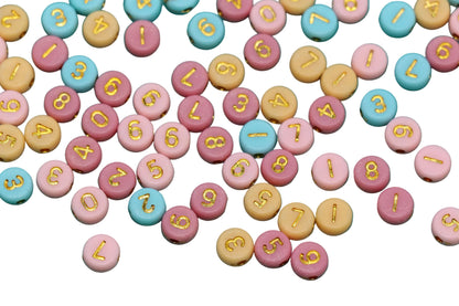 Colorful round candies with numbers and letters on a white background