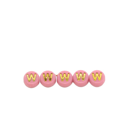 Five pink beads with gold letters 'W' on a white background