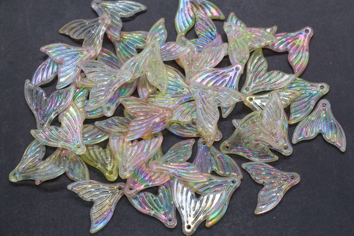 Iridescent butterfly-shaped charm