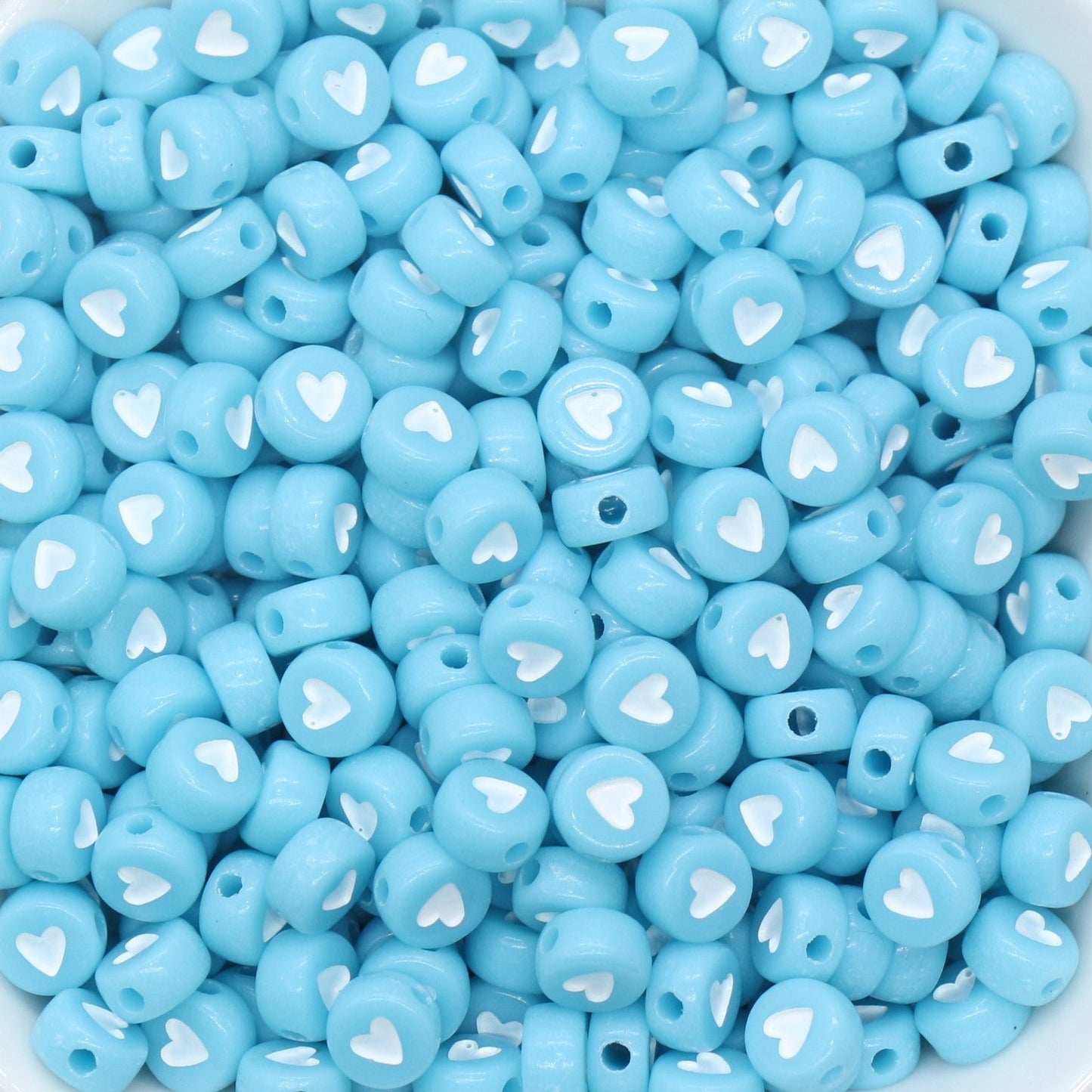 blue beads with white heart in center