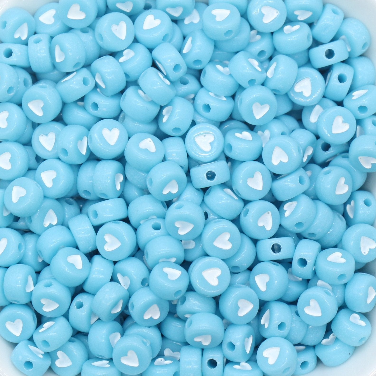 blue beads with white heart in center