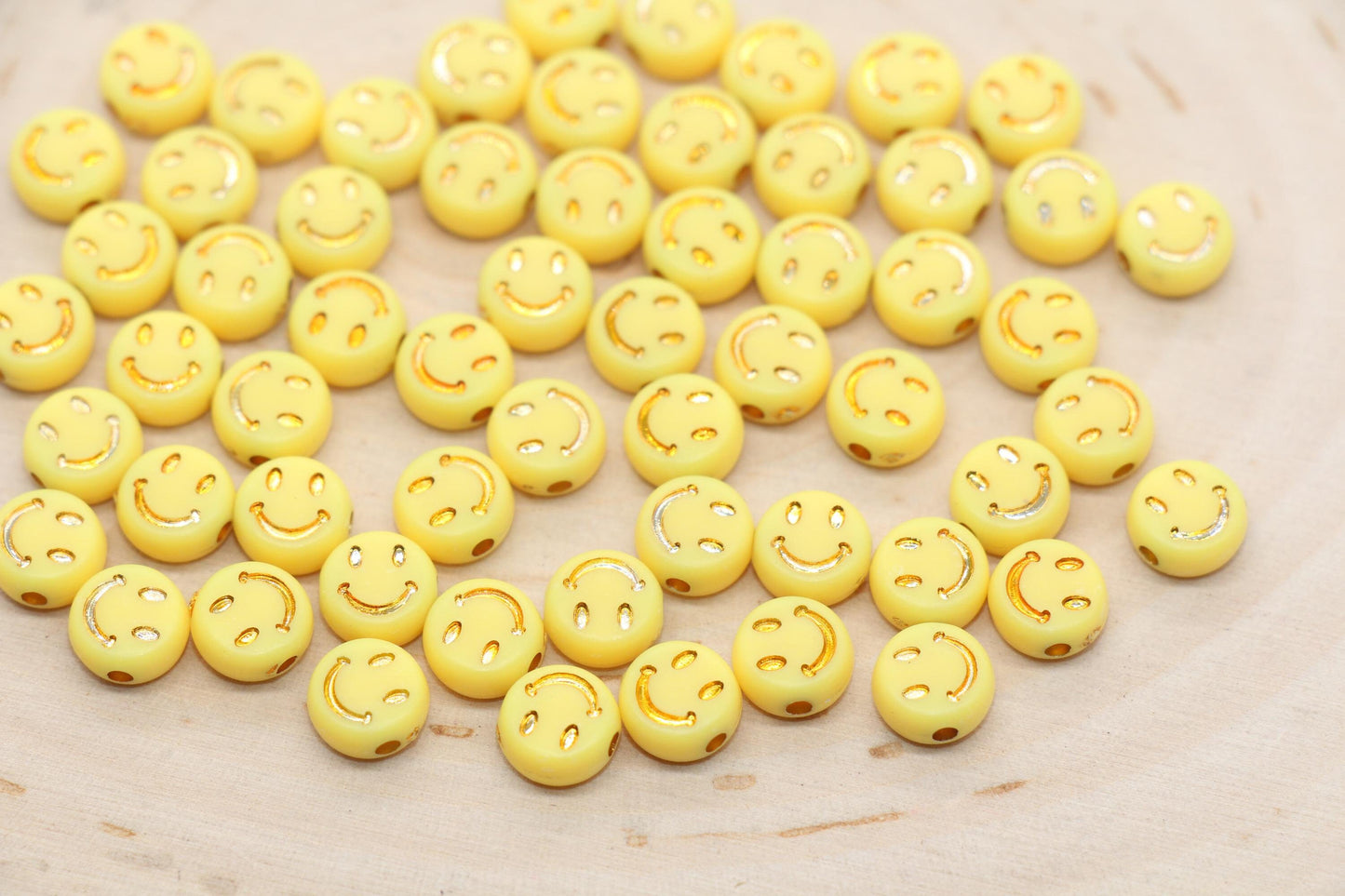 gold smiley face bead in round shape for jewelry making and craft projects