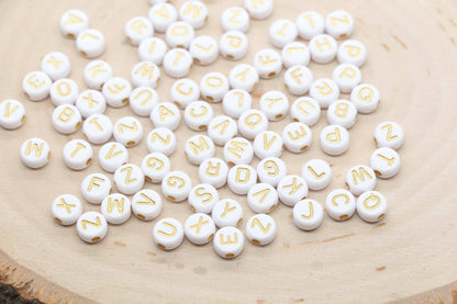 round shape white beads with bronze lettering