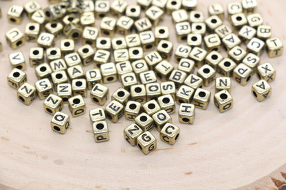 cube shape gold beads with black lettering, mix square gold letter beads