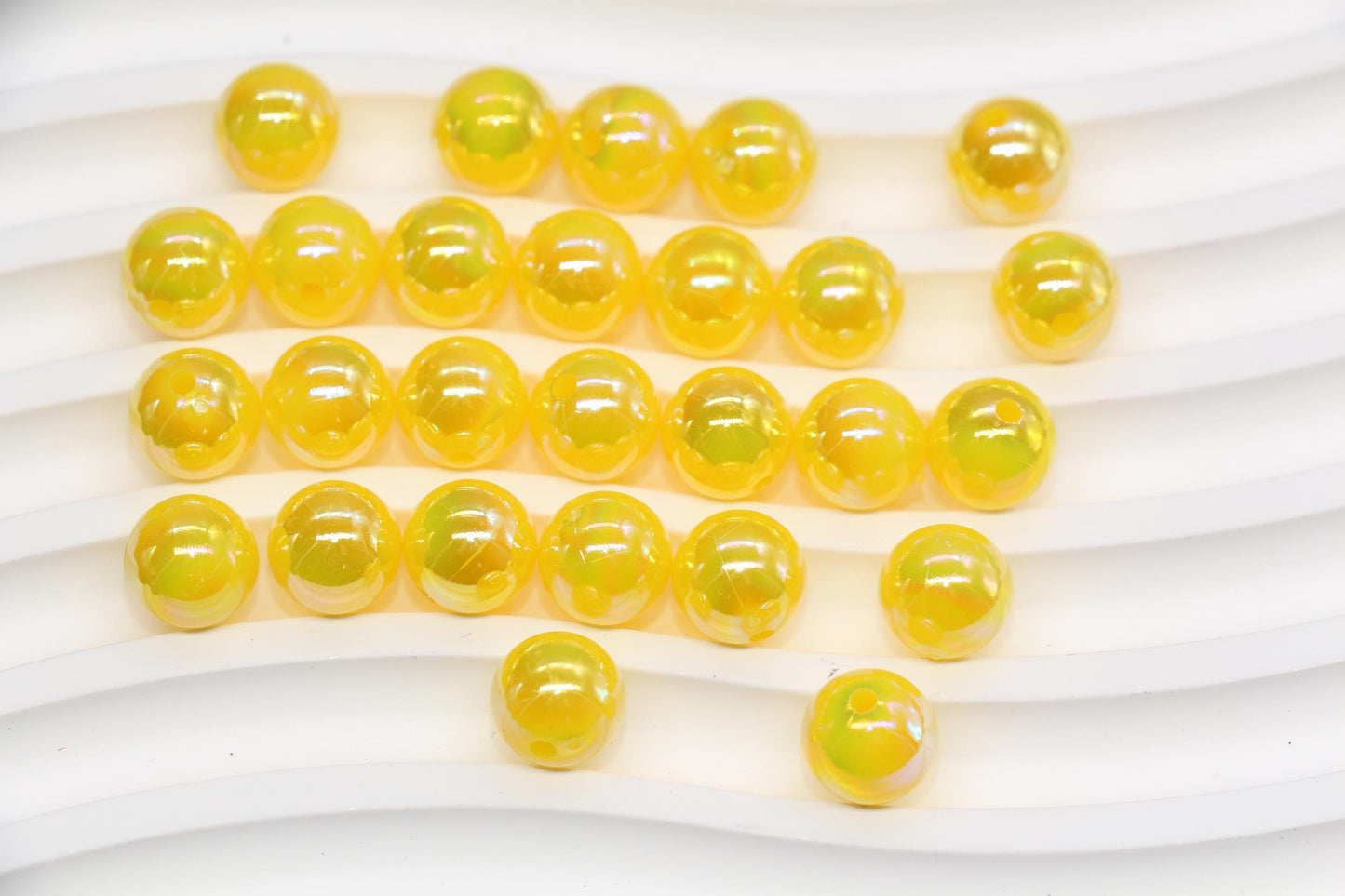 10mm golden yellow AB gumball acrylic beads with glossy iridescent finish for bracelets, keychains, lanyards, jewelry making, and DIY crafts.