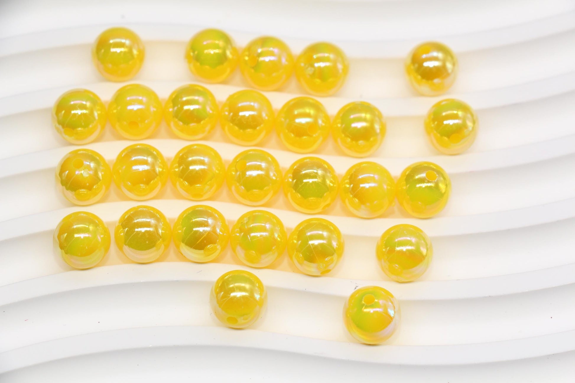 10mm golden yellow AB gumball acrylic beads with glossy iridescent finish for bracelets, keychains, lanyards, jewelry making, and DIY crafts.