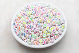 7 mm round acrylic neon number beads on white base; white with neon numbers