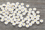 7 mm round acrylic number beads, white with gold numbers; 7mm round