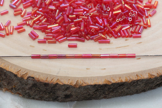 Red AB Bugle Beads, perfect for embellishing clothing, accessories, and craft projects.
