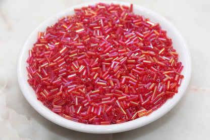 Red AB Bugle Beads, perfect for embellishing clothing, accessories, and craft projects.