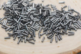 6mm Gunmetal Bugle Beads, perfect for embellishing clothing, accessories, and craft projects.