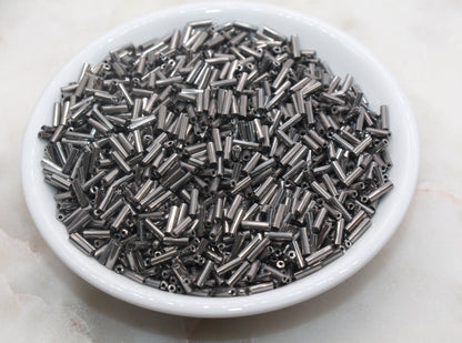 6mm Gunmetal Bugle Beads, perfect for embellishing clothing, accessories, and craft projects.